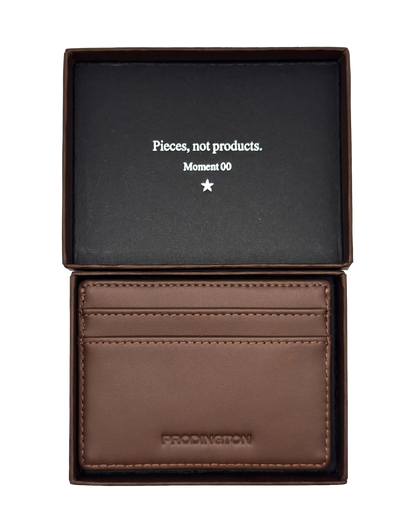 Brown leather wallet in a black box with text on a white background
